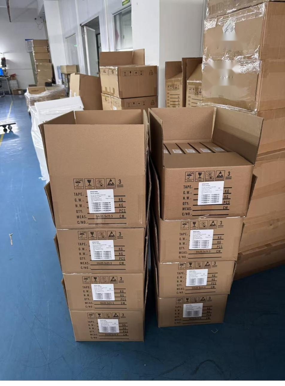 OPS PC modules being boxed with spec labels before palletizing